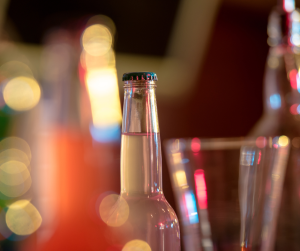 Stylised photo of drinks bottles and glasses. 