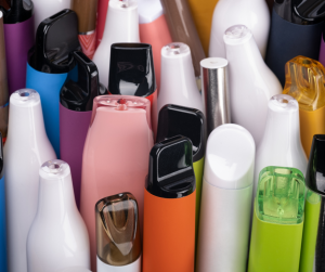 A close up of disposable and reusable vapes of all colours, shapes and sizes. 